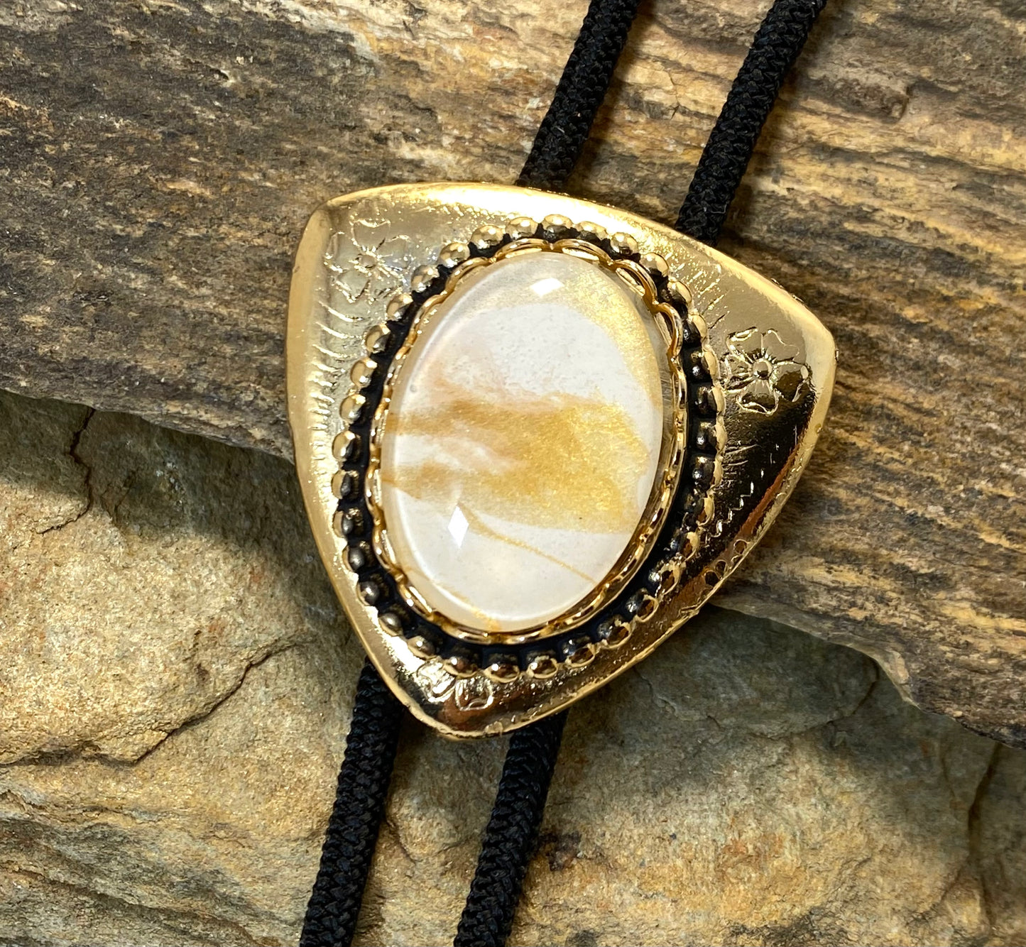 Eye-catching gold and white bolo and buckle set