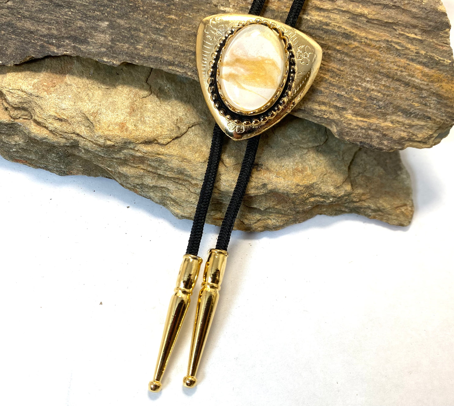 Eye-catching gold and white bolo and buckle set