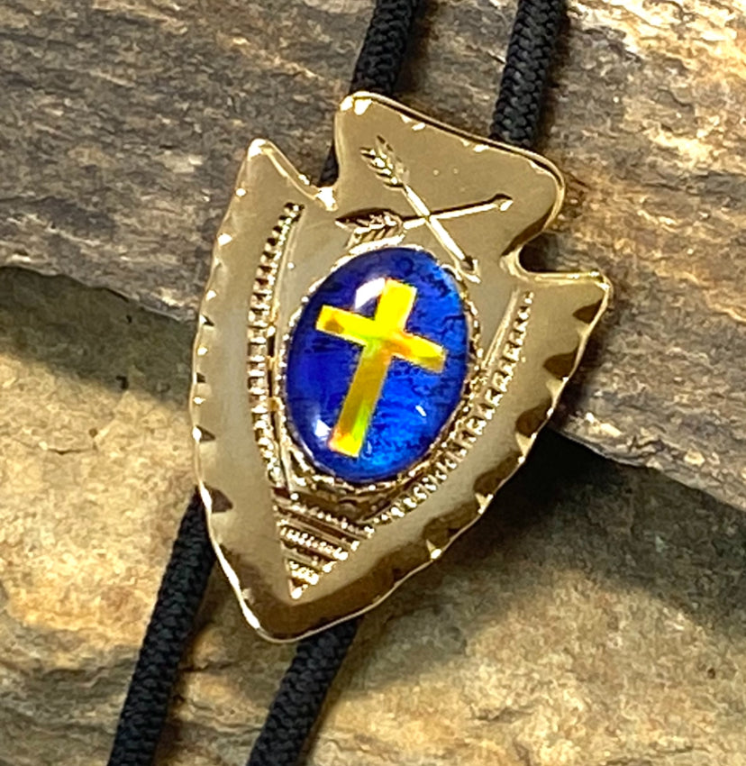 Lightweight golden arrowhead bolo with gold holographic cross