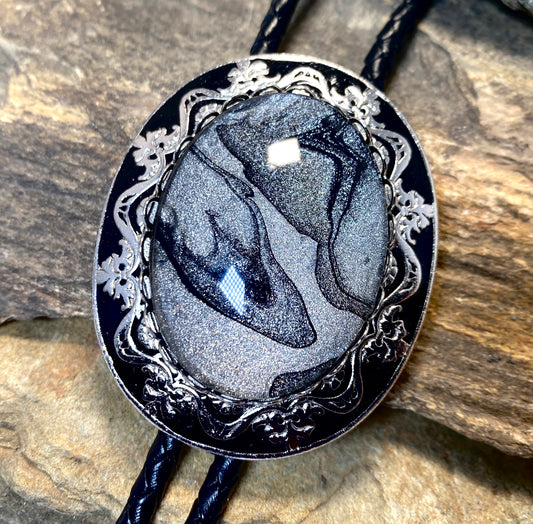 Large dressy bolo with handsome black and platinum hand painted stone no