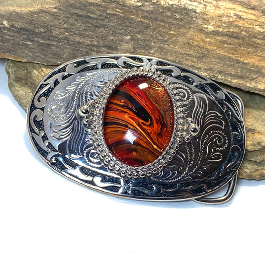 Red earthtone art in silver and black belt buckle