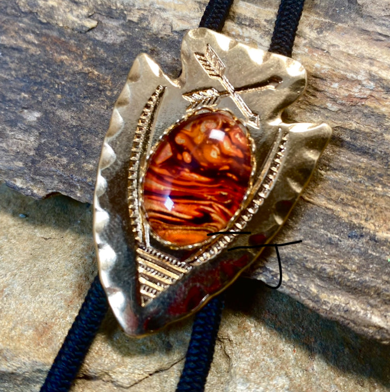 Lightweight golden arrowhead bolo with earthtone hand painted stone