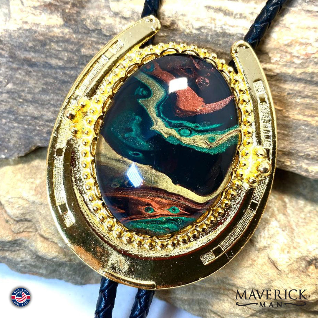 Golden Horseshoe bolo tie with hand painted stone in green earthtones