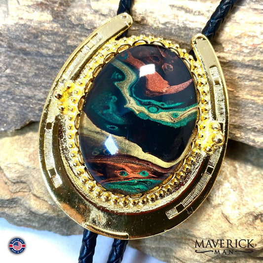 Golden Horseshoe bolo tie with hand painted stone in green earthtones