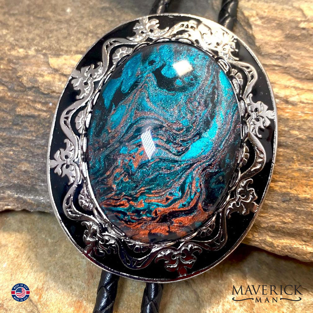 Silver and black filigree bolo tie and buckle set with hand painted stones