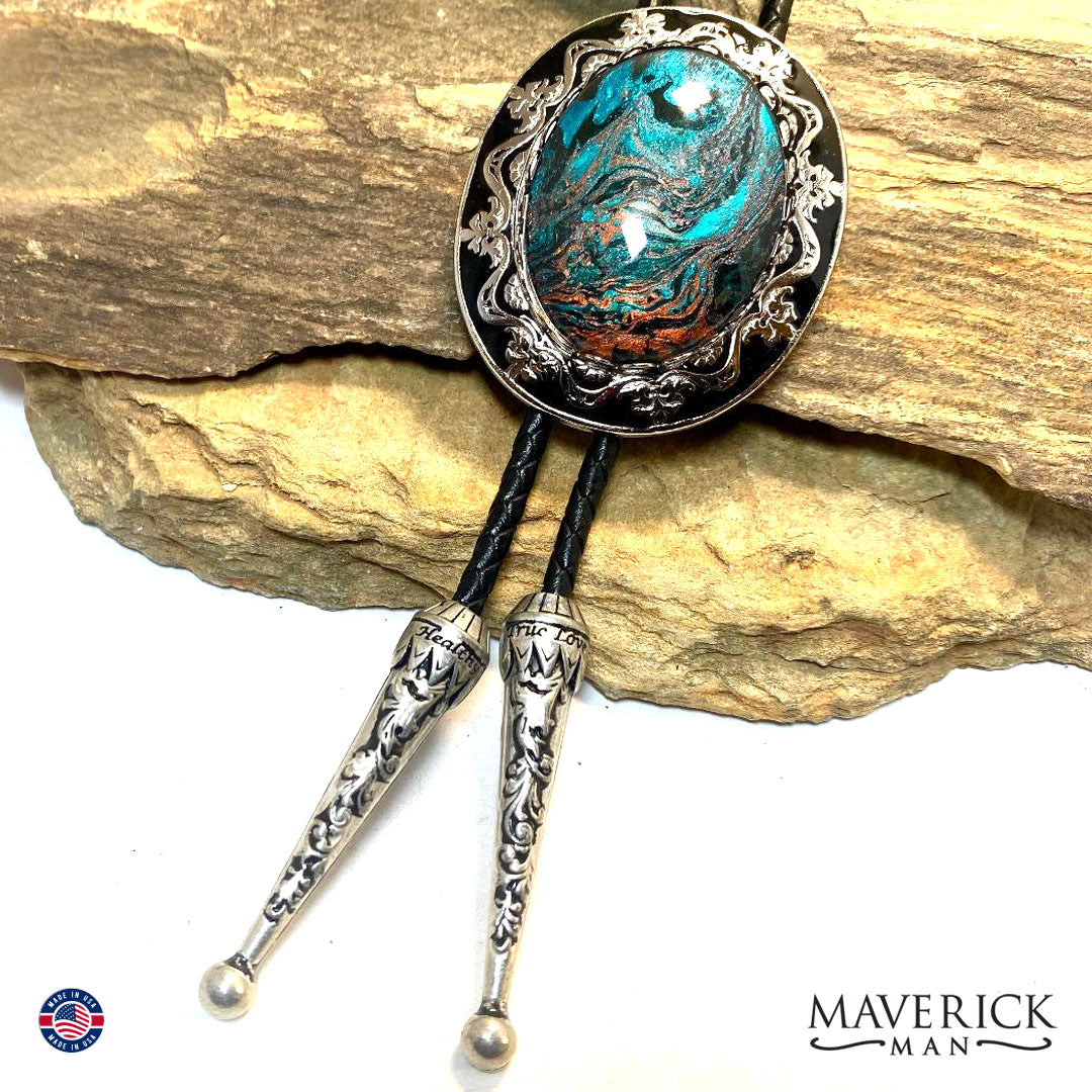 Silver and black filigree bolo tie and buckle set with hand painted stones