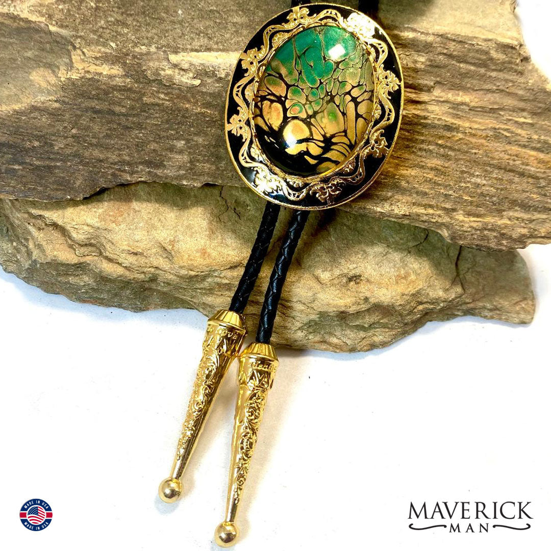 Gold and black filigree bolo tie with hand painted stone