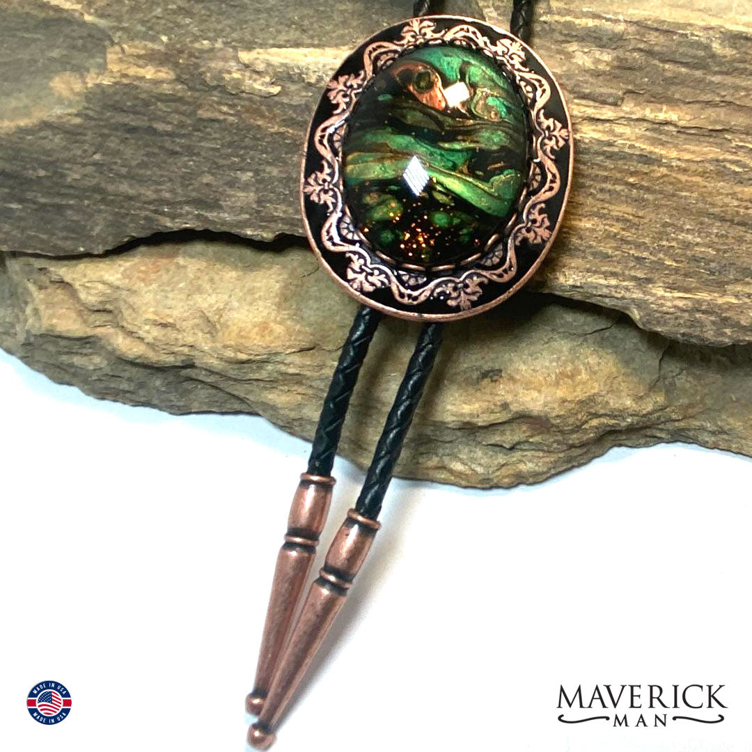 Black and copper filigree bolo tie with hand painted stone