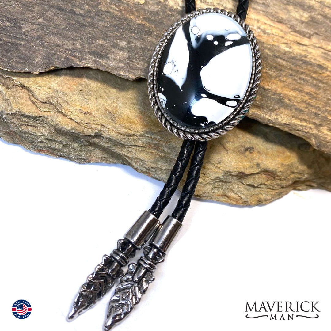 Black and white hand painted stone in braided silver bolo tie