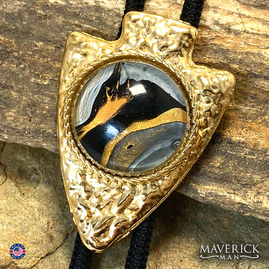 Golden hammered arrowhead bolo tie with hand painted stone