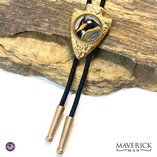 Golden hammered arrowhead bolo tie with hand painted stone