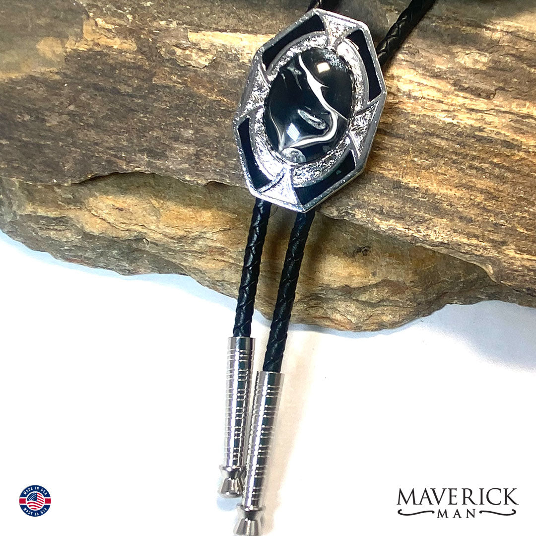Silver bolo tie with black and white hand painted stone