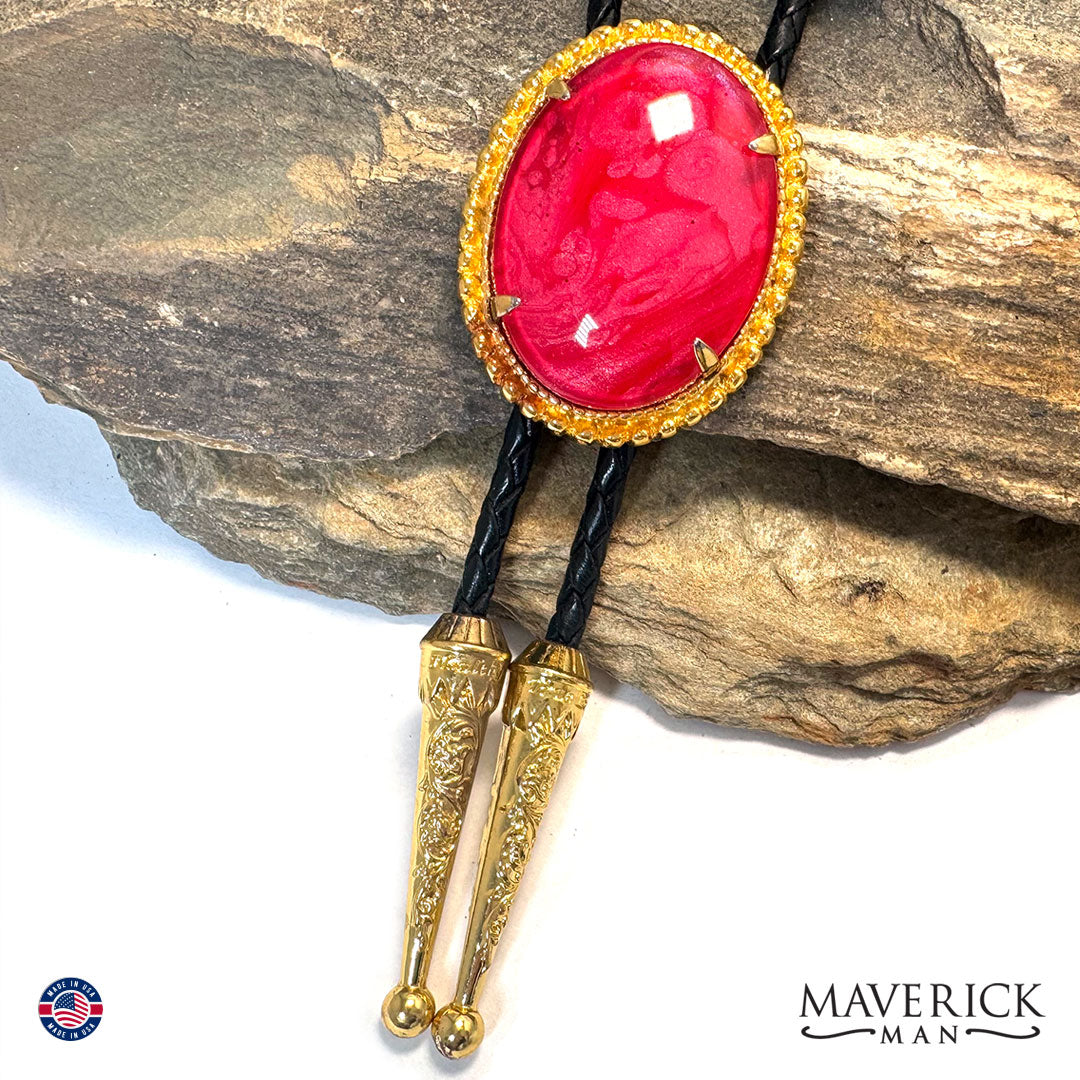 Gold bolo tie with hand painted red on red stone