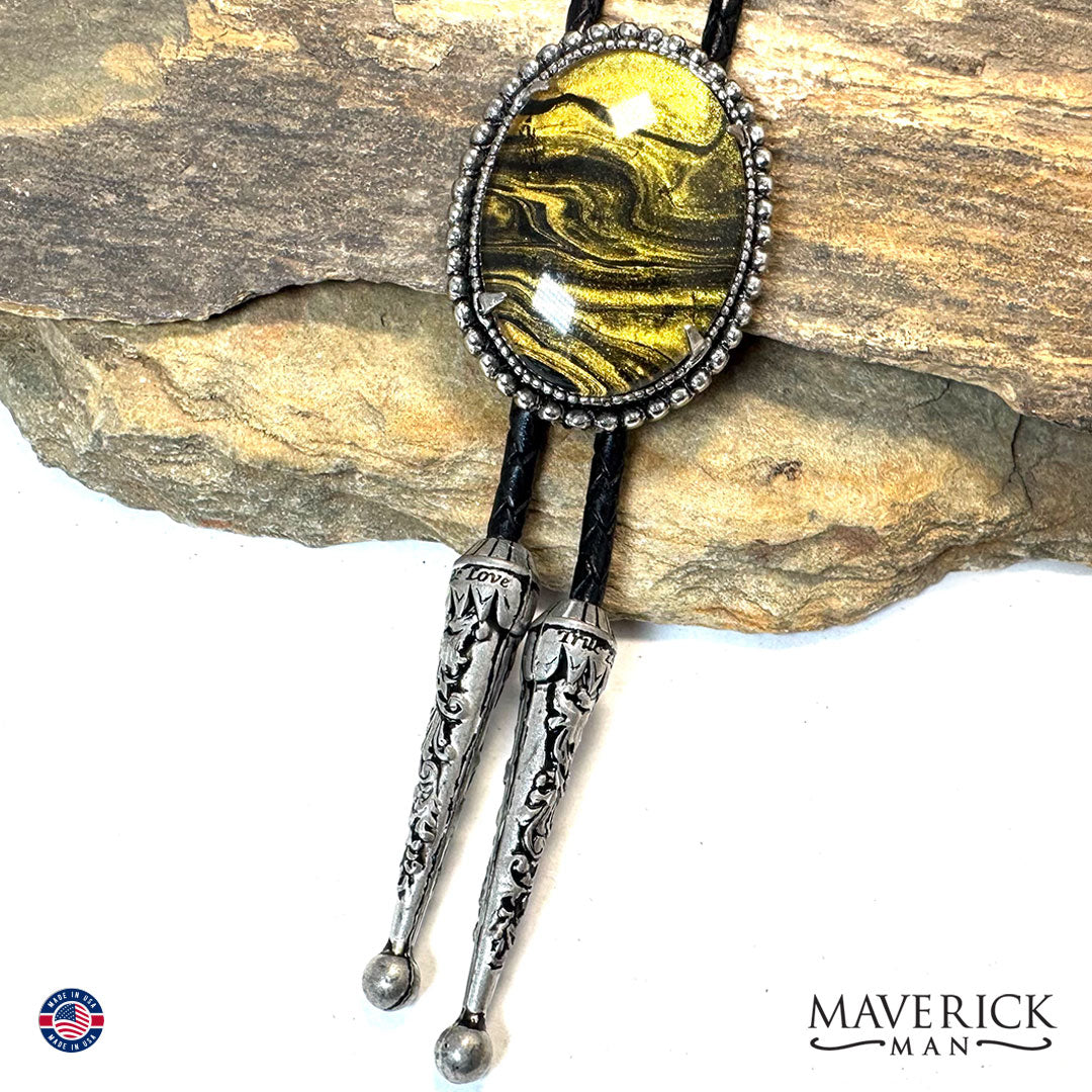 Beaded bolo tie with gold and black hand painted stone
