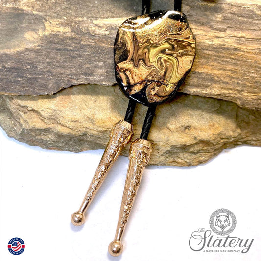 Rich earthtones and black on bolo tie made from slate