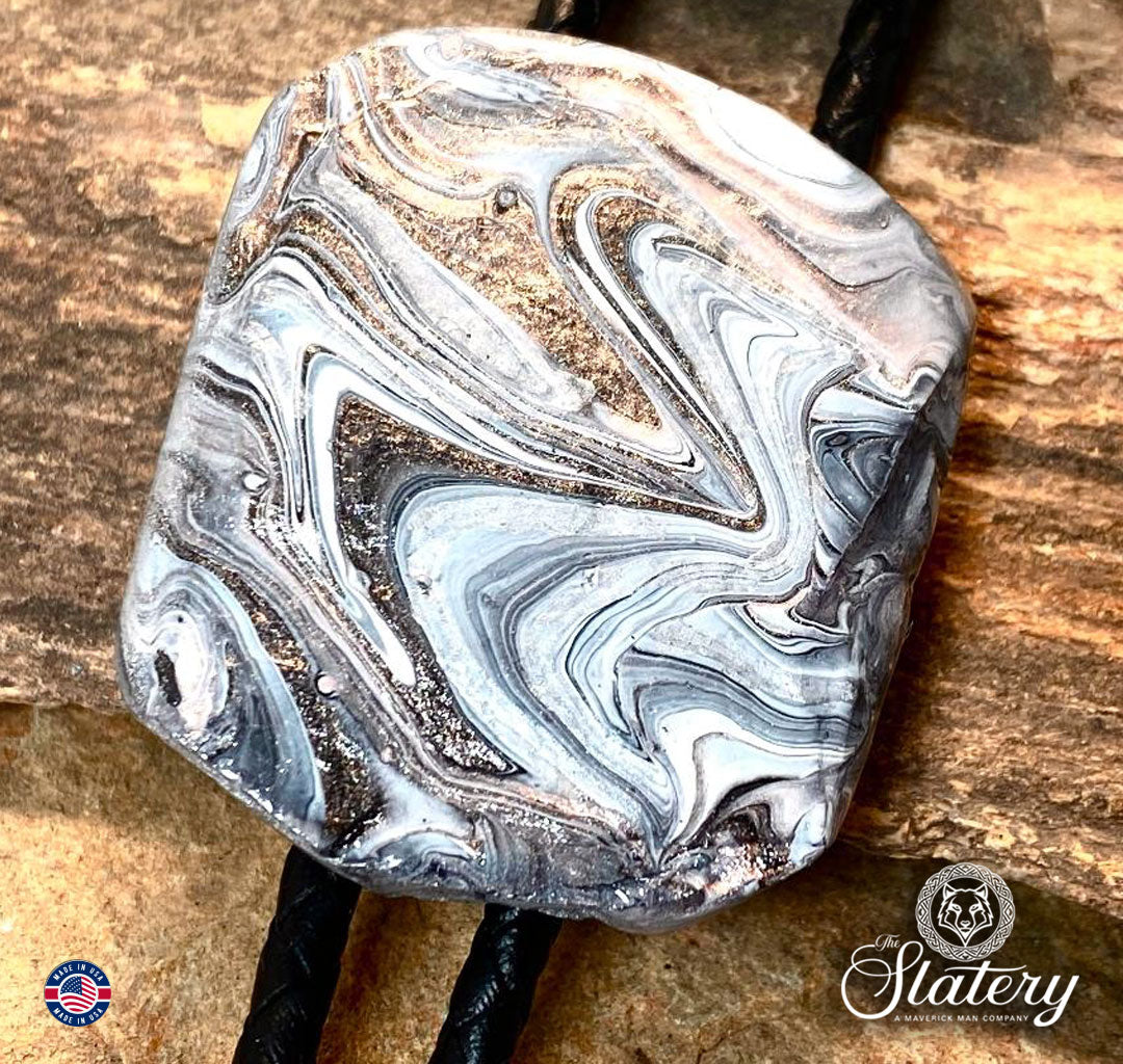 Unusual black and white bolo tie with rose gold accents