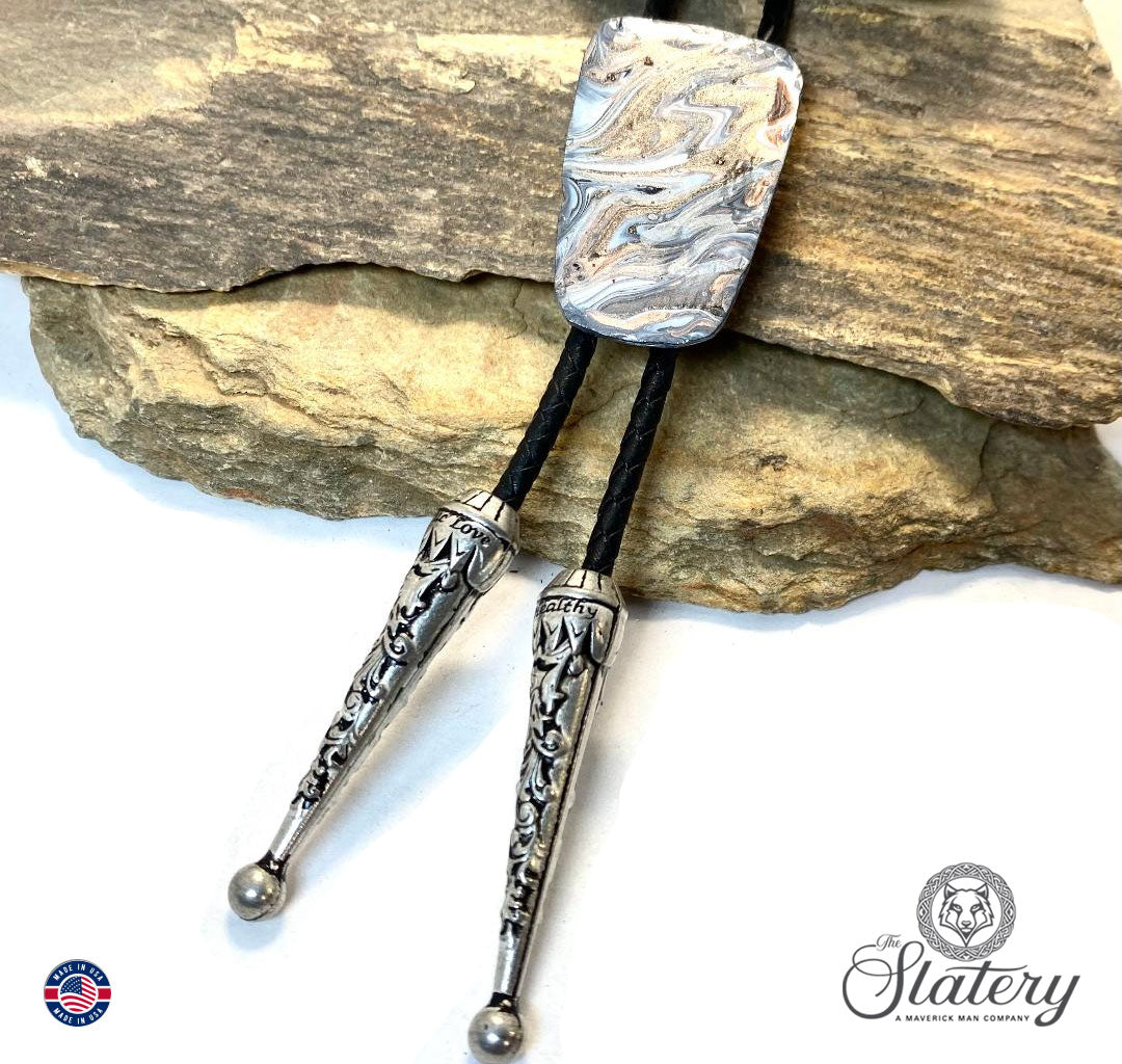 Unusual black and white bolo tie with rose gold accents