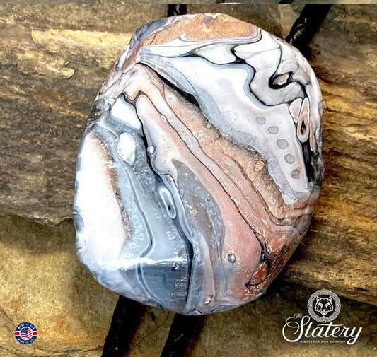 Handsome black and white bolo tie with rose gold accents