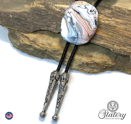 Handsome black and white bolo tie with rose gold accents