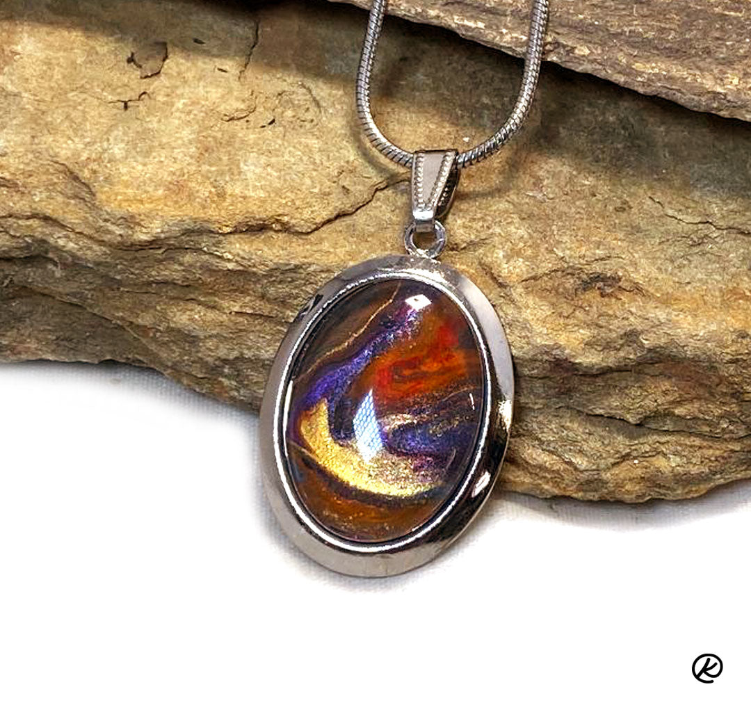 Silver arrowhead bolo with southwestern colors