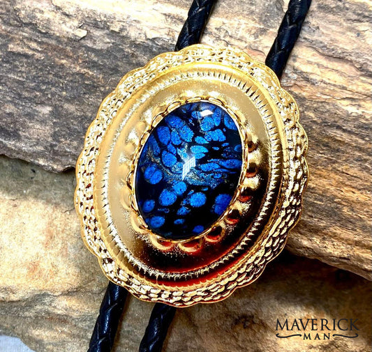 Sapphire and black hand painted stone set into golden concho bolo