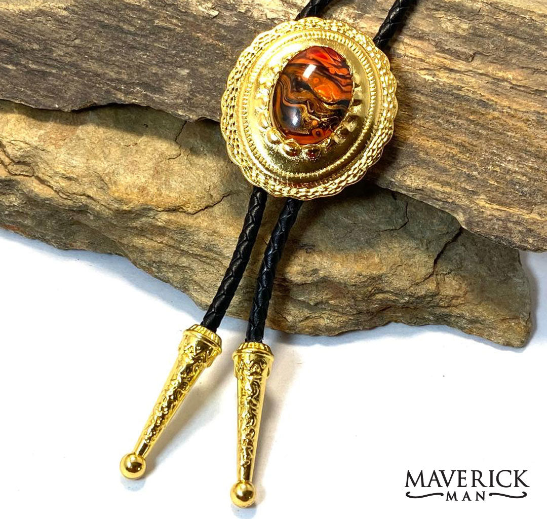 Golden concho bolo with orange and black hand painted stone