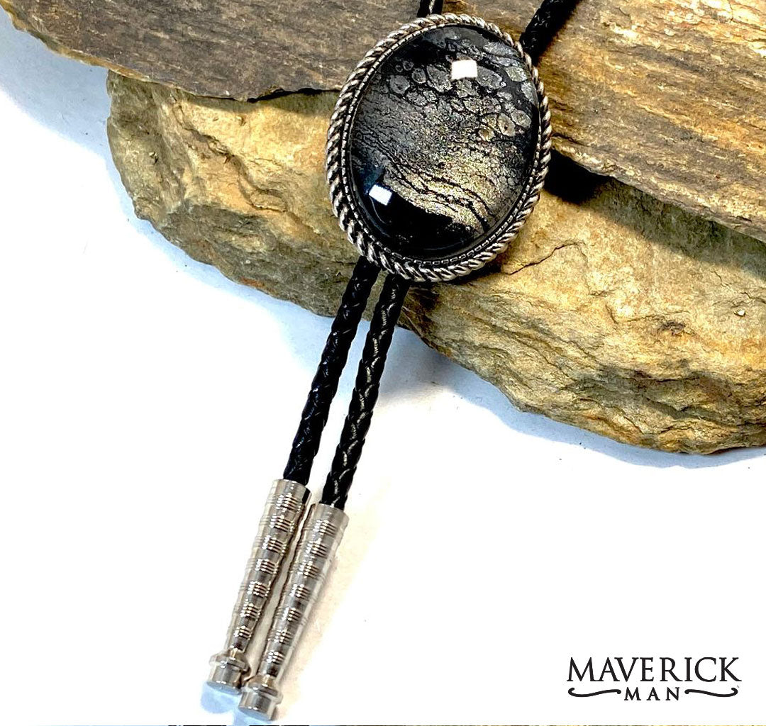 Large silver braided bolo with black and platinum hand painted stone