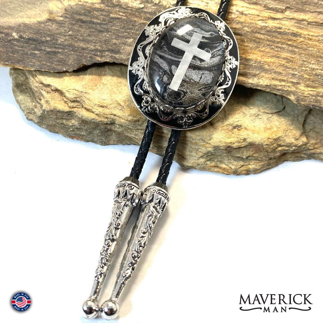 Dressy silver and black filigree cross bolo with hand painted stone