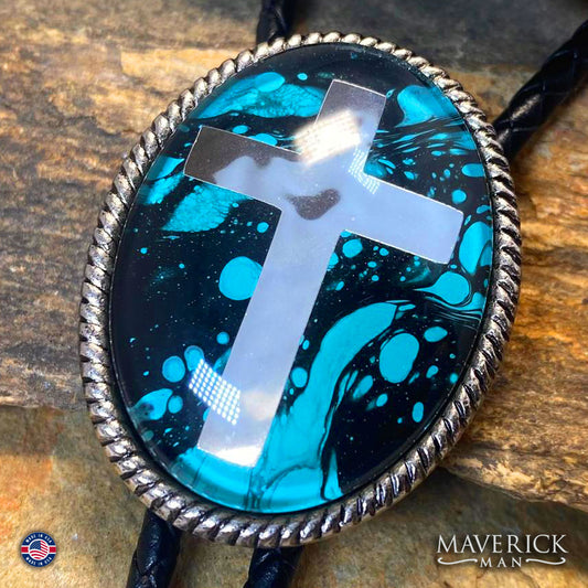 Turquoise and black hand painted stone in braided silver cross bolo