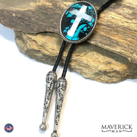 Turquoise and black hand painted stone in braided silver cross bolo