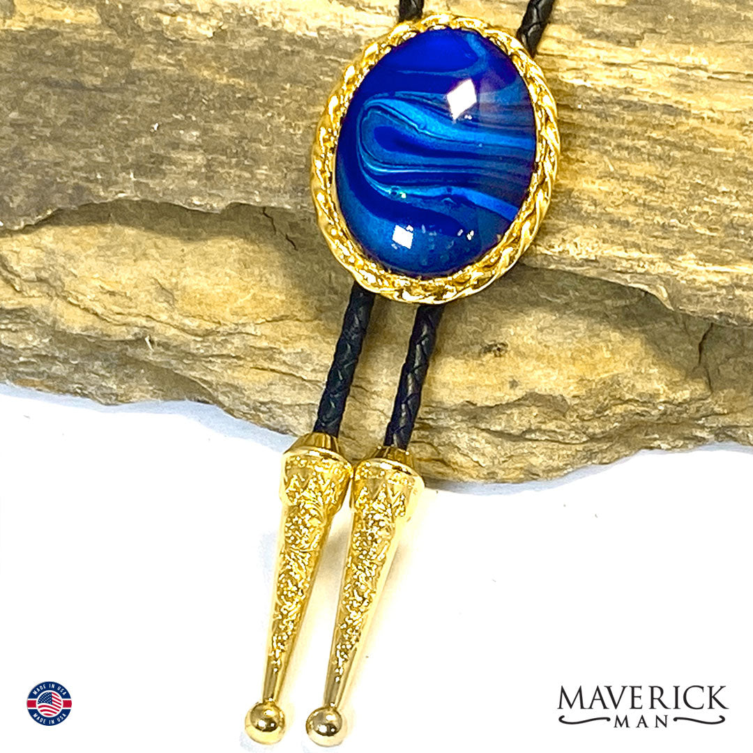 Striking black and blue bolo tie and buckle set in gold