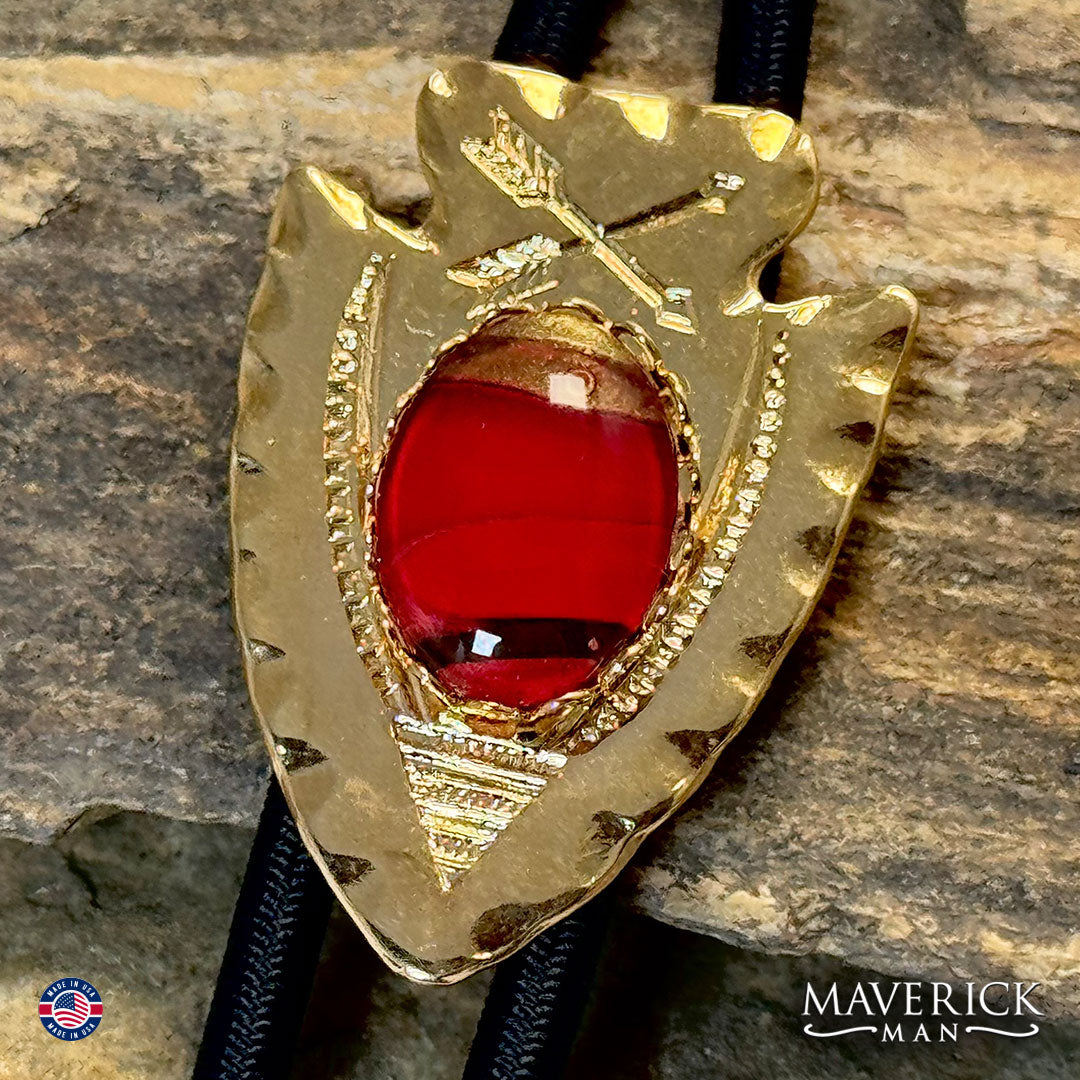 Golden arrowhead bolo tie with hand painted stone