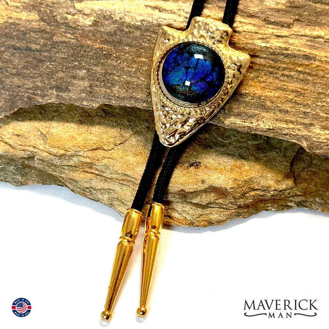 Golden hammered arrowhead bolo tie with hand painted stone