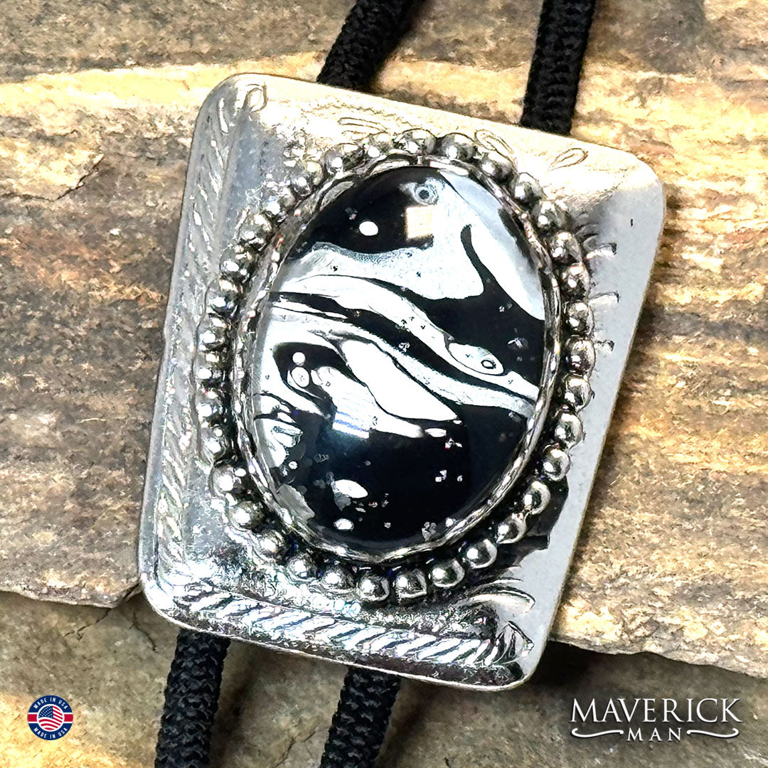 Silver bolo tie with hand painted black and white stone
