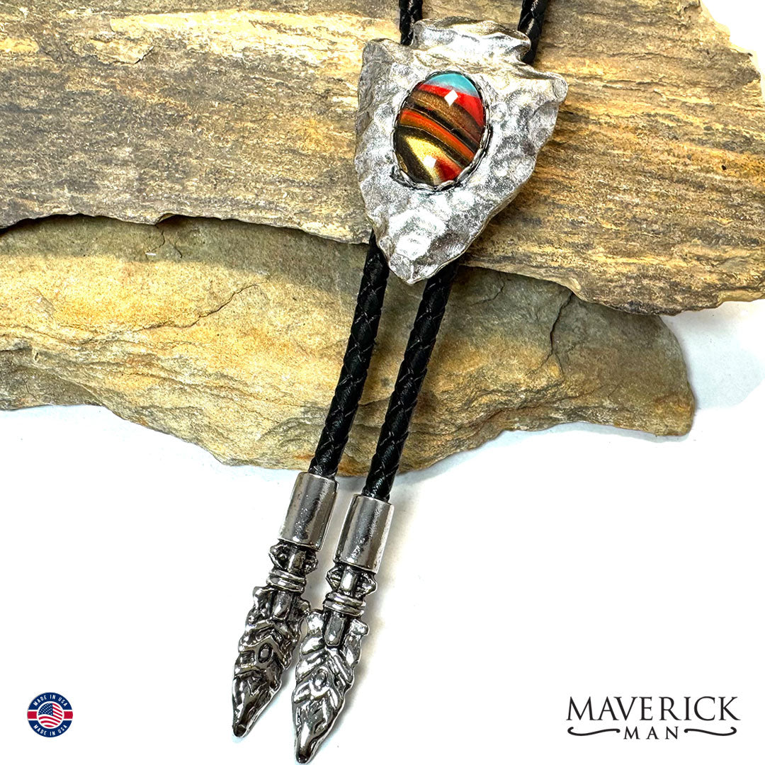 Hammered arrowhead bolo with hand painted southwestern stone