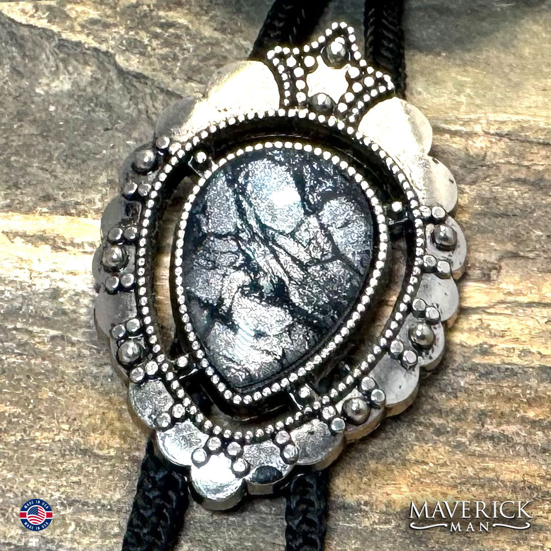 Silver bolo with black and platinum hand painted stone