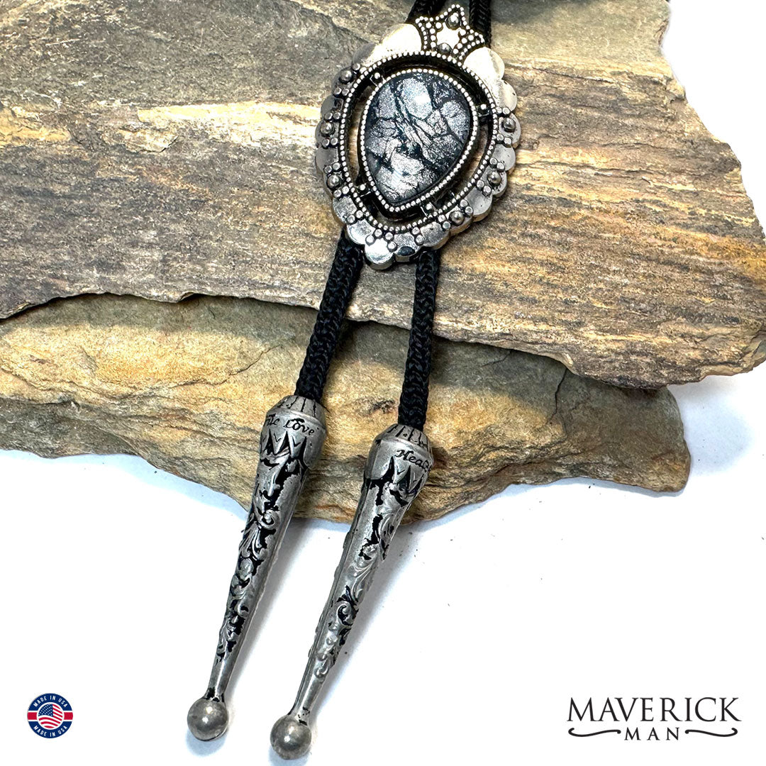 Silver bolo with black and platinum hand painted stone