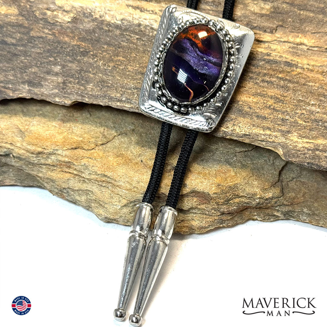 Silver bolo tie with hand painted purple and orange stone
