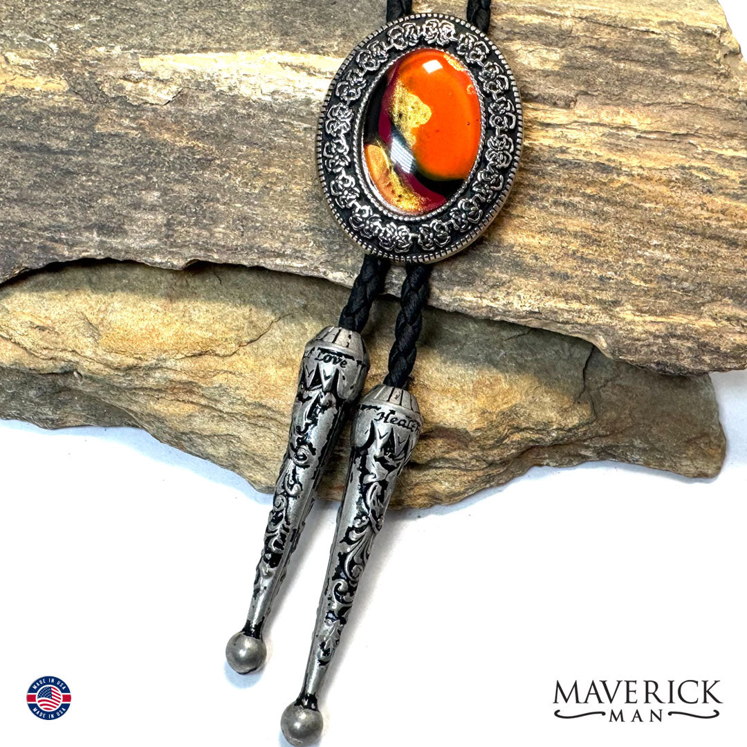 Silver filigree bolo tie with hand painted orange stone