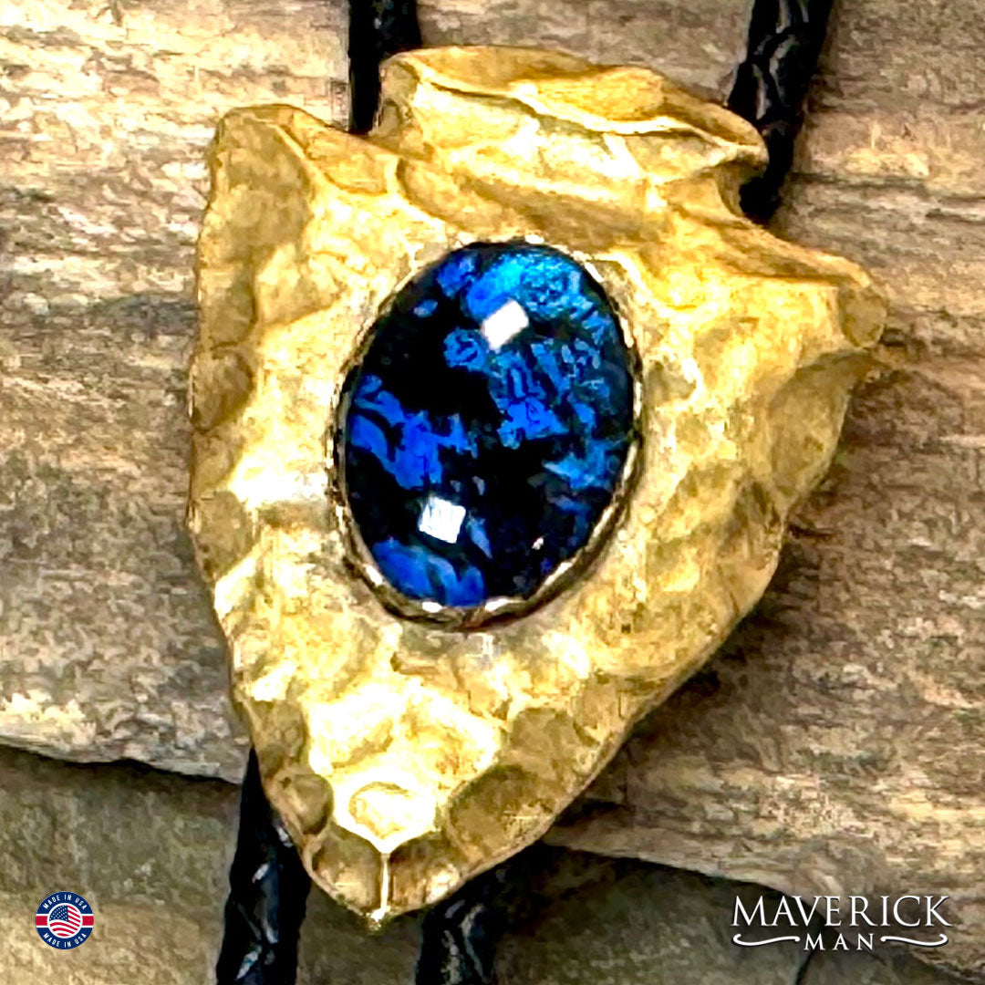Golden hammered arrowhead bolo tie with hand painted stone