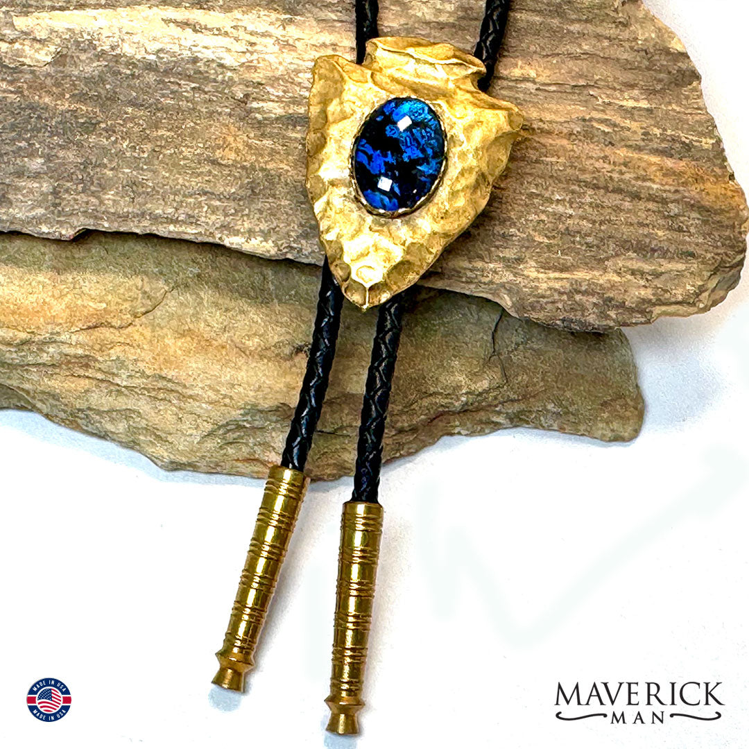 Golden hammered arrowhead bolo tie with hand painted stone