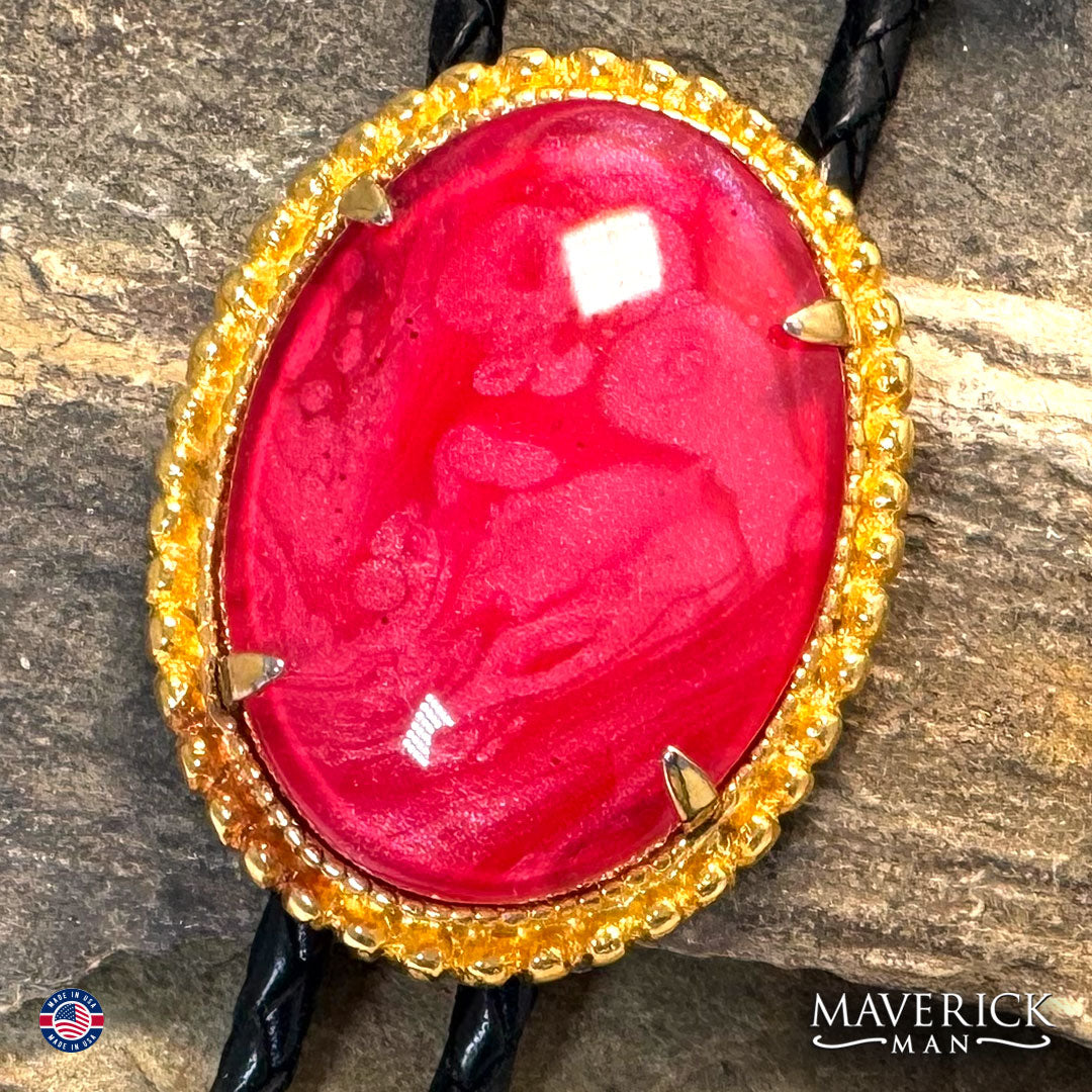 Gold bolo tie with hand painted red on red stone