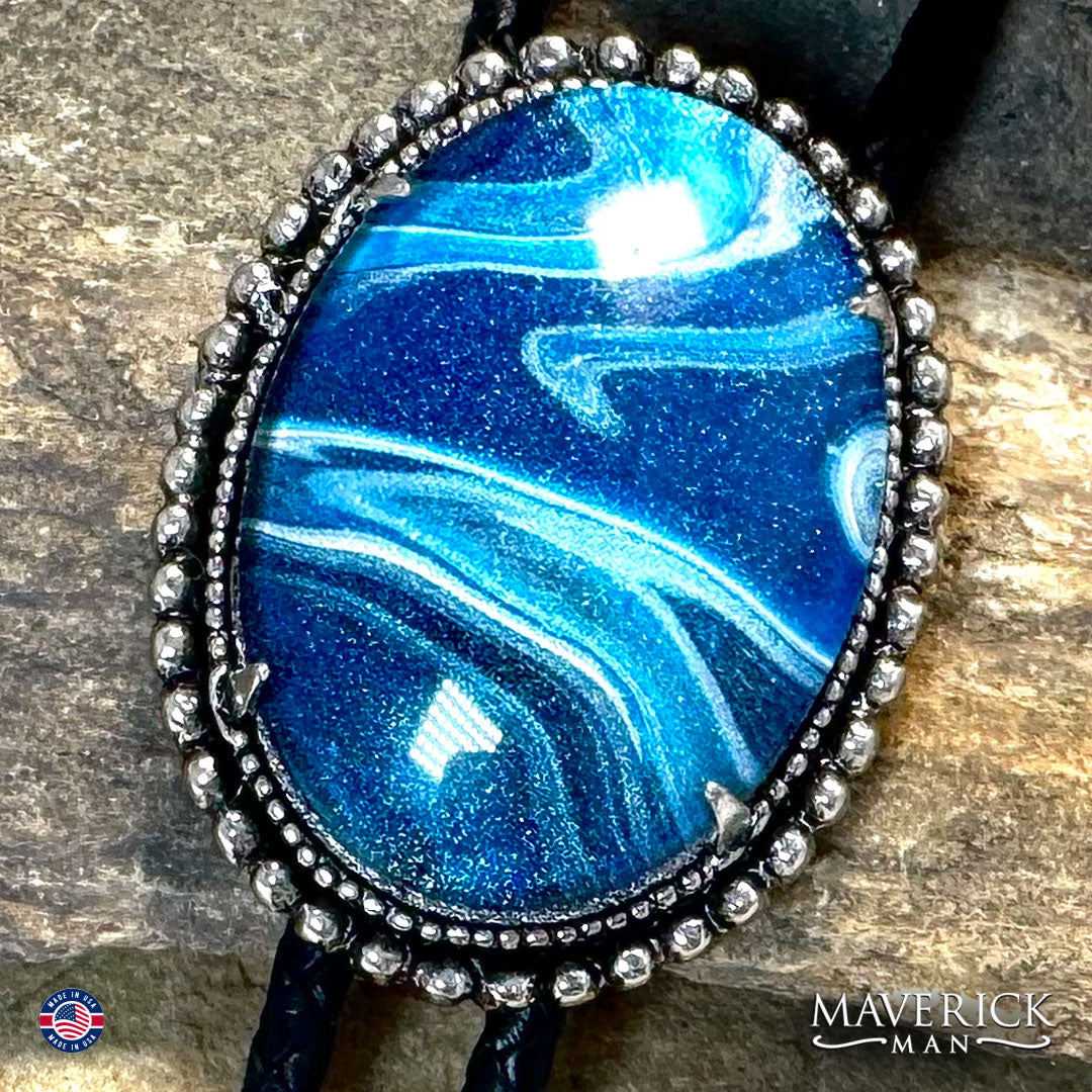 Great denim blue hand painted stone in silver bolo tie