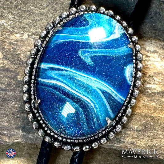 Great denim blue hand painted stone in silver bolo tie