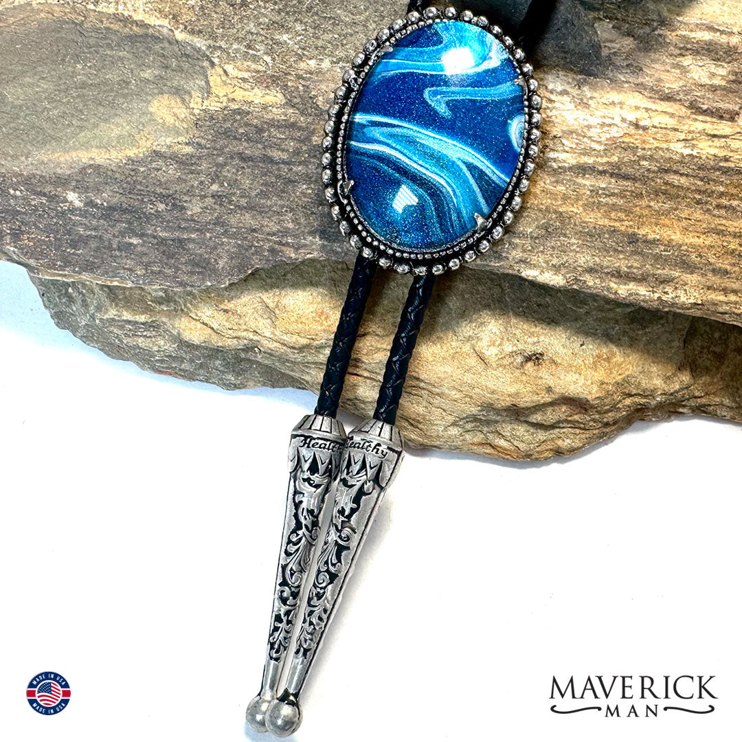 Great denim blue hand painted stone in silver bolo tie
