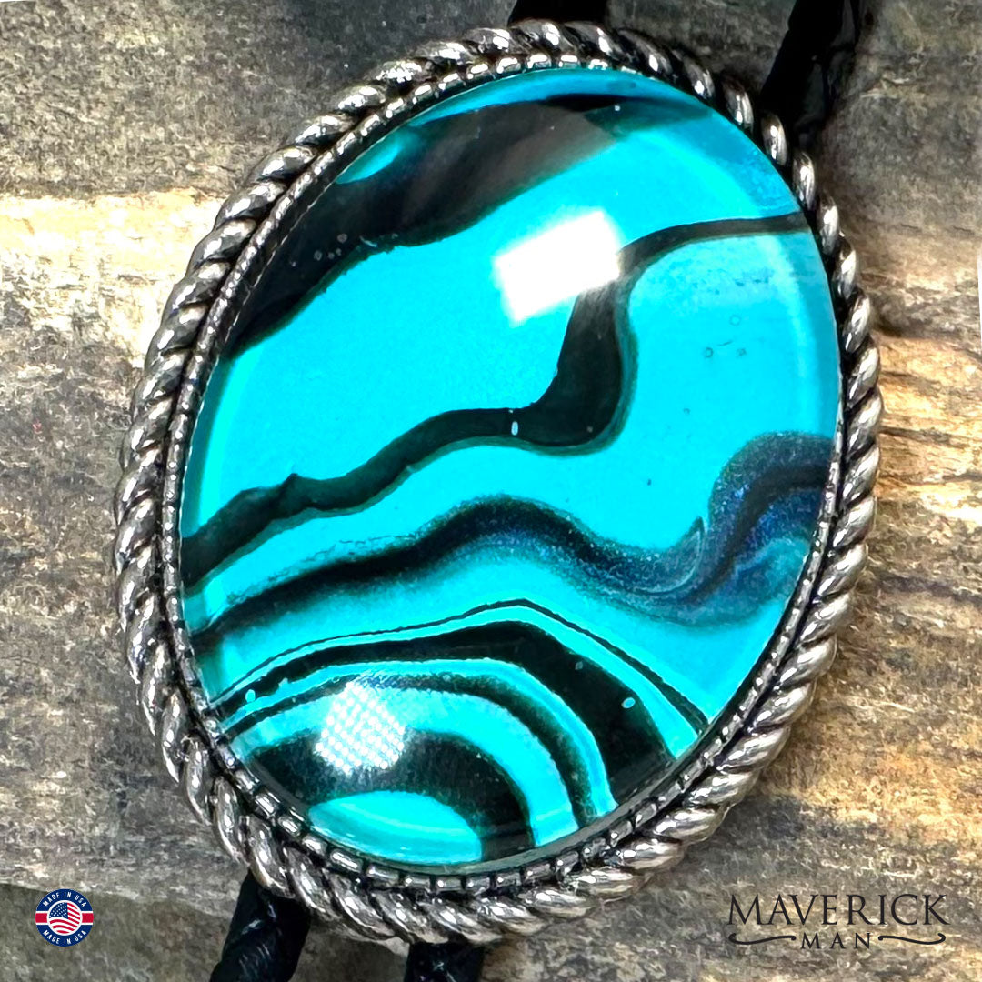Rich turquoise and black hand painted stone in silver bolo tie