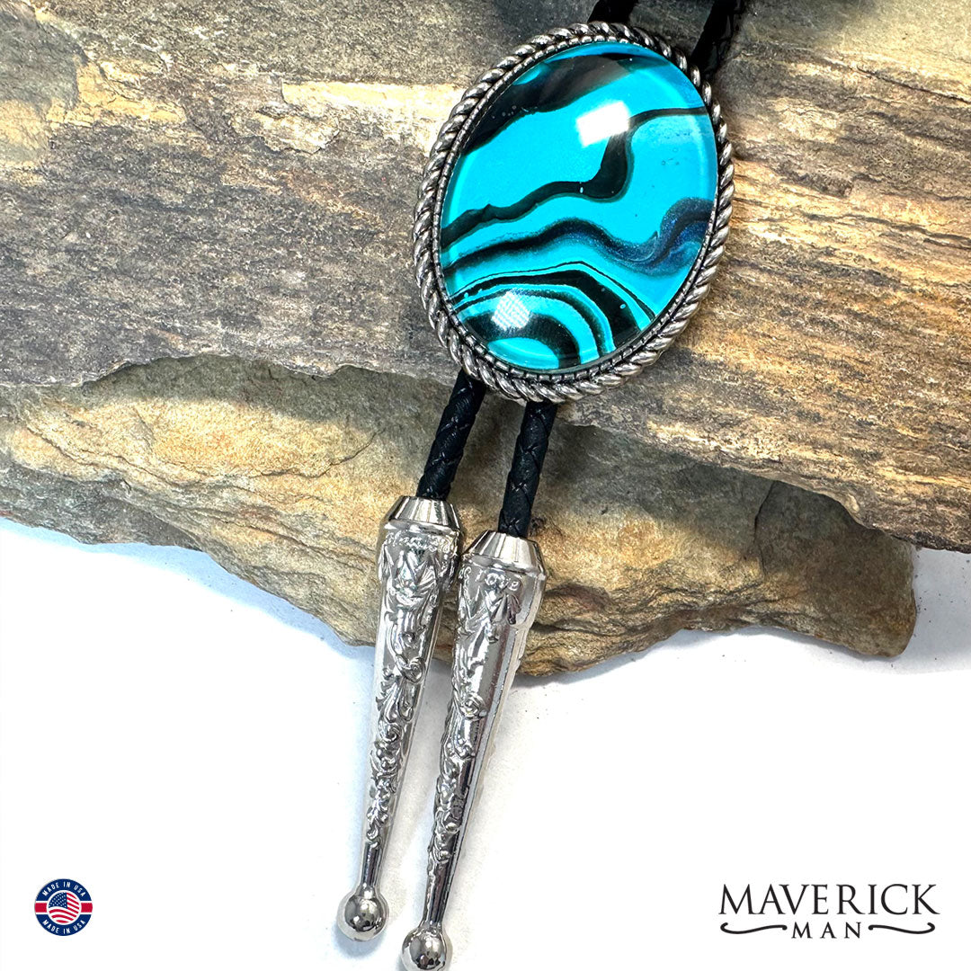 Rich turquoise and black hand painted stone in silver bolo tie