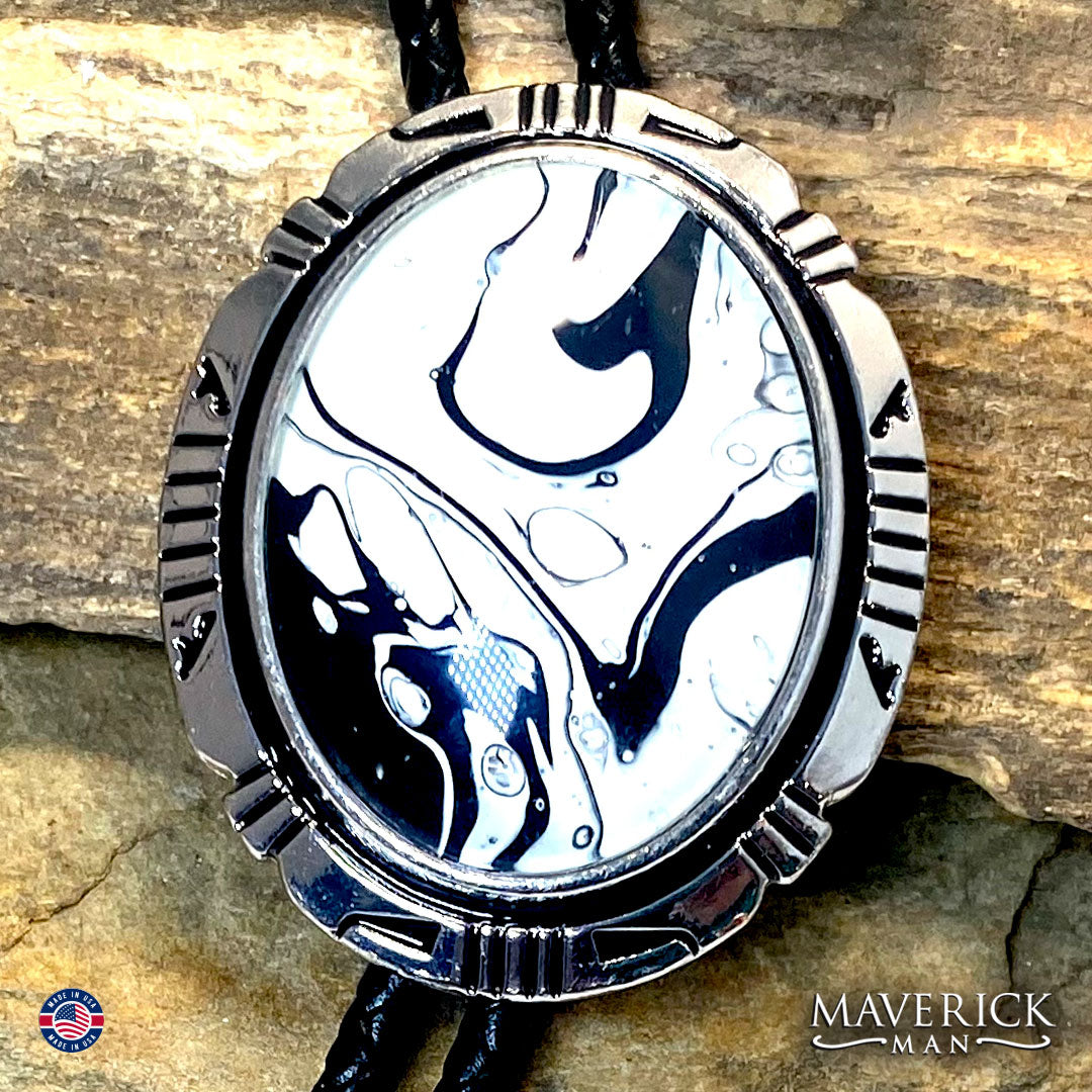 Silver bolo tie with hand painted black and white stone