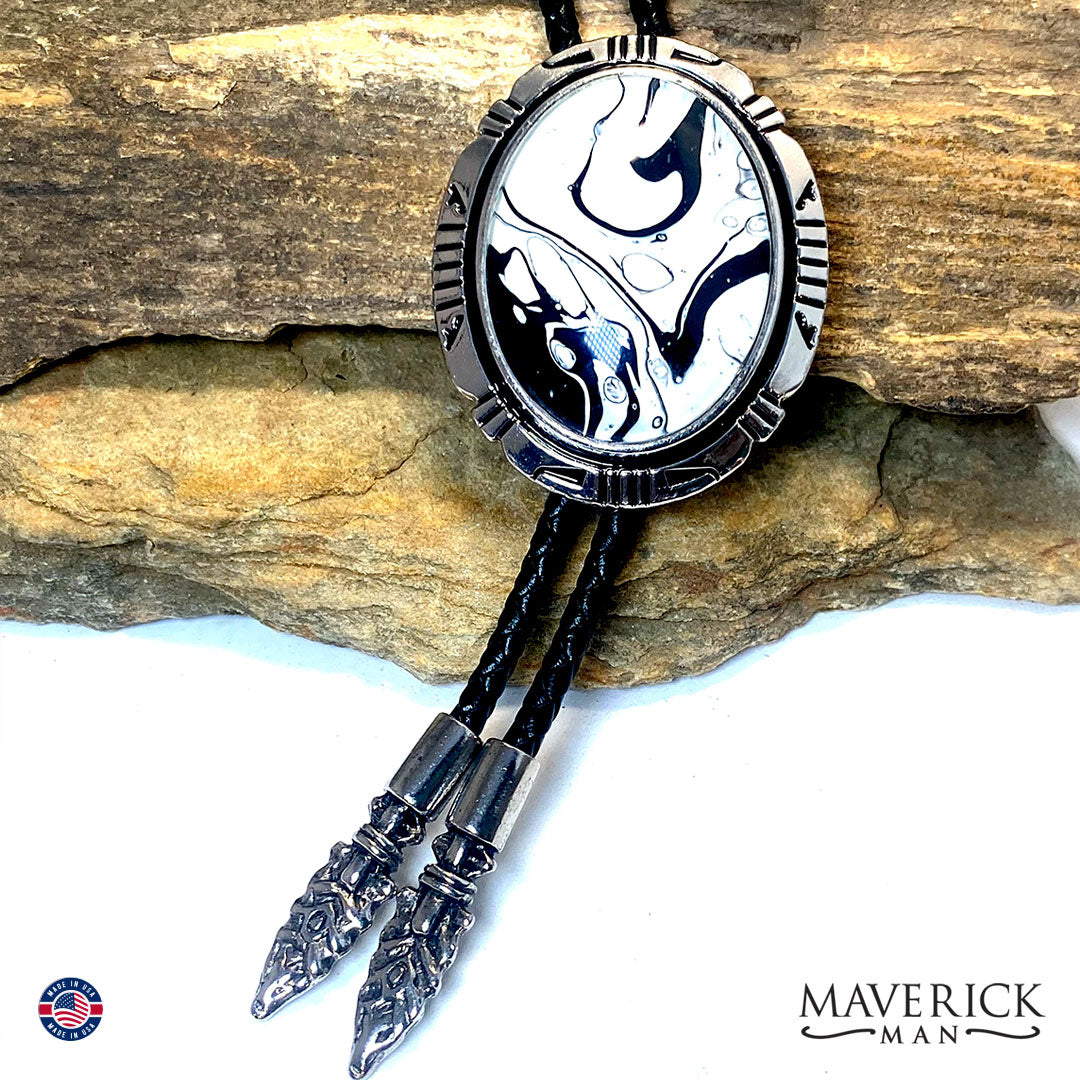 Silver bolo tie with hand painted black and white stone