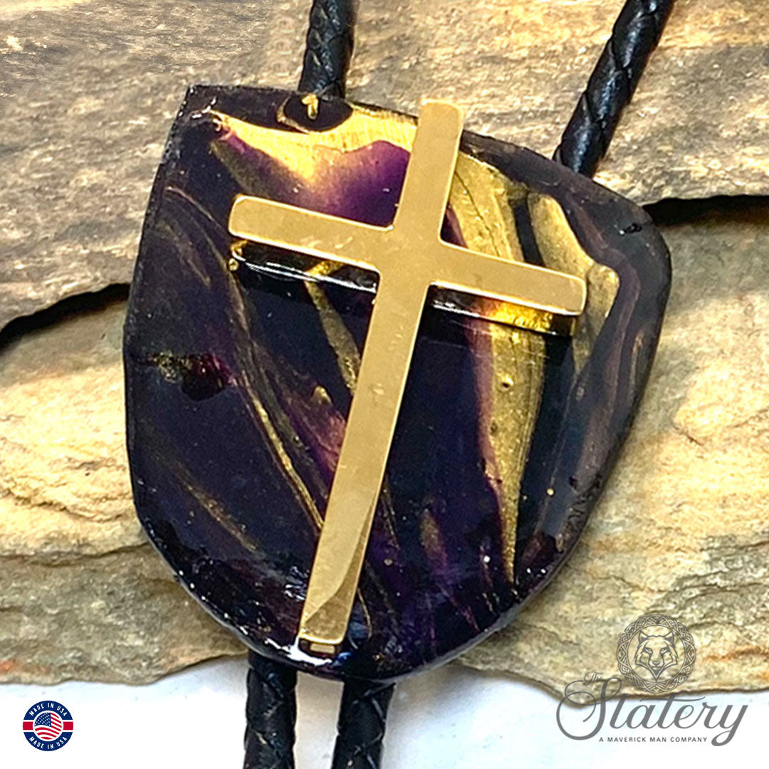 Black bolo tie with purple and gold accents and stainless steel cross